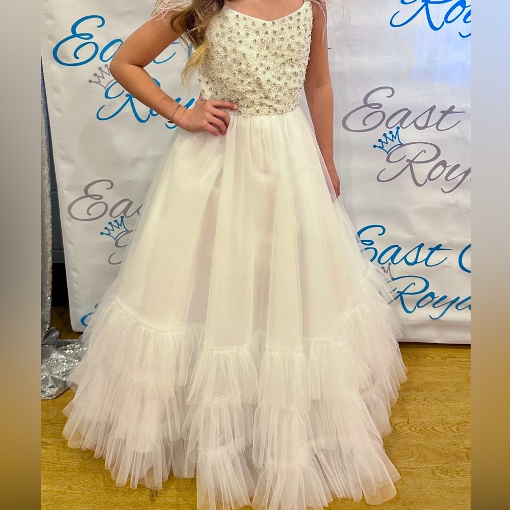 White pageant gown with feather sleeves